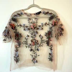 Light pink sheet top with floral appliqué. Never worn.